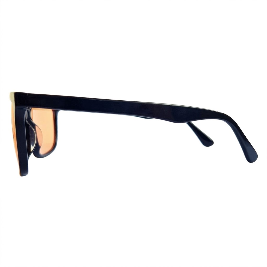 Urban Hippee's amber lens blue light blocking glasses side view. Urban Hippee's amber lens blue light blocking glasses side view.