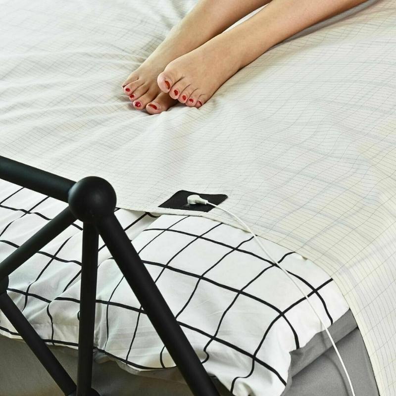 Earthing & grounding sheet with legs resting on top.