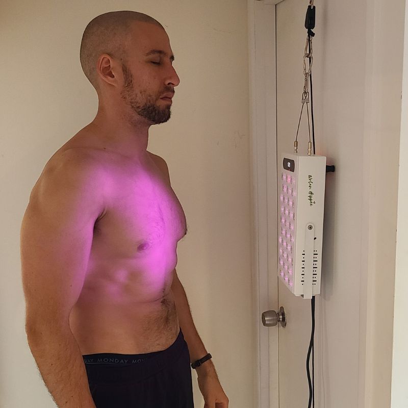 Red light therapy and infrared Proplus 300 hanging on door.