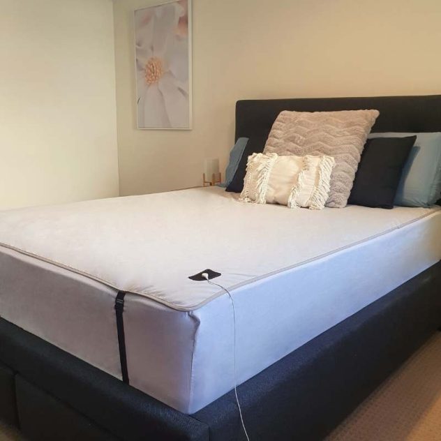 Premium grounding sheet underlay on a queen size bed.