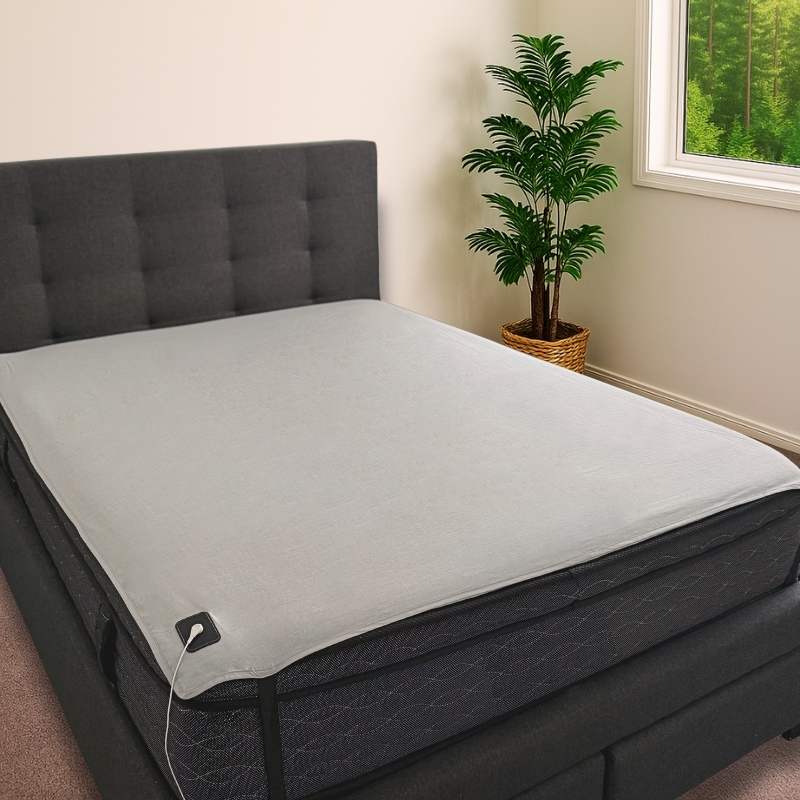 Underlay earthing & grounding sheet secured to a queen size bed.