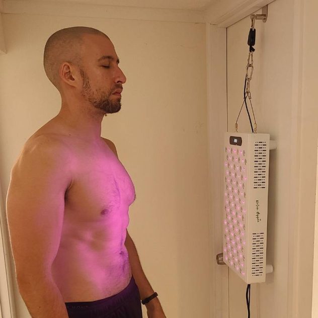 Red light therapy and infrared Proplus 600 being used by man.