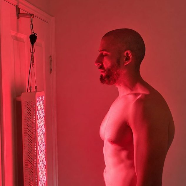 Man using ProX red light therapy panel.