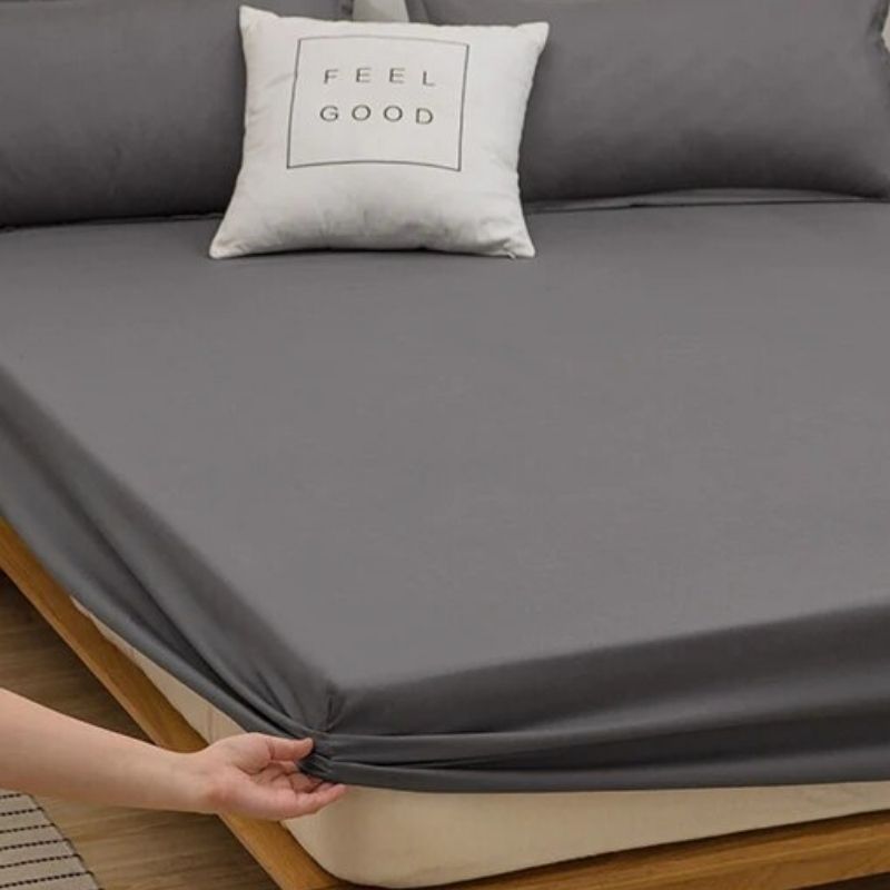 Fitted cotton grounding & earthing sheet in a dark grey color fitted on bed.