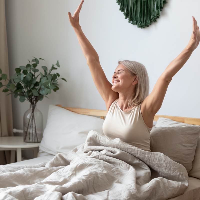 Women sleep on earthing sheet feeling refreshed from grounding all night. 