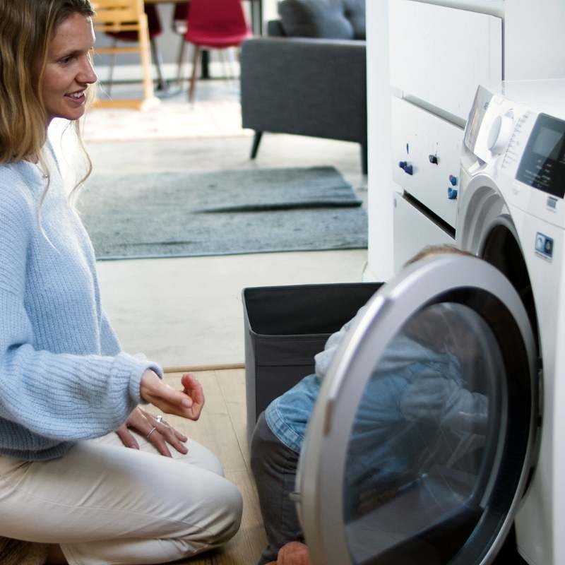 Grounding sheets being washed in washing machine.