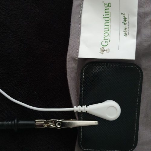 Earthing mat being tested with multimeter.